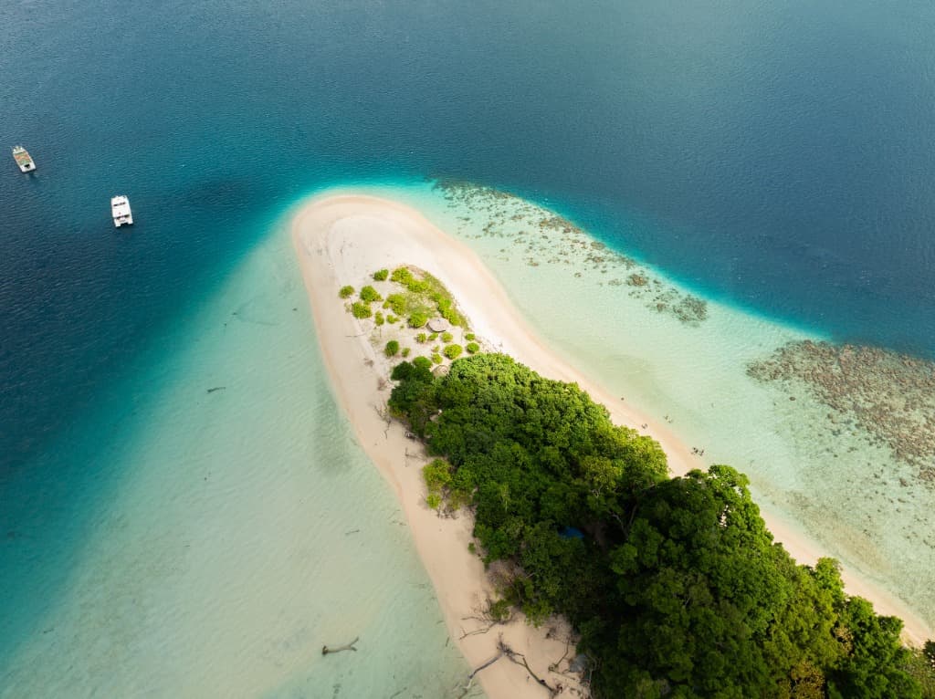 Aerial view of pristine Andaman sandbar and turquoise coral reefs